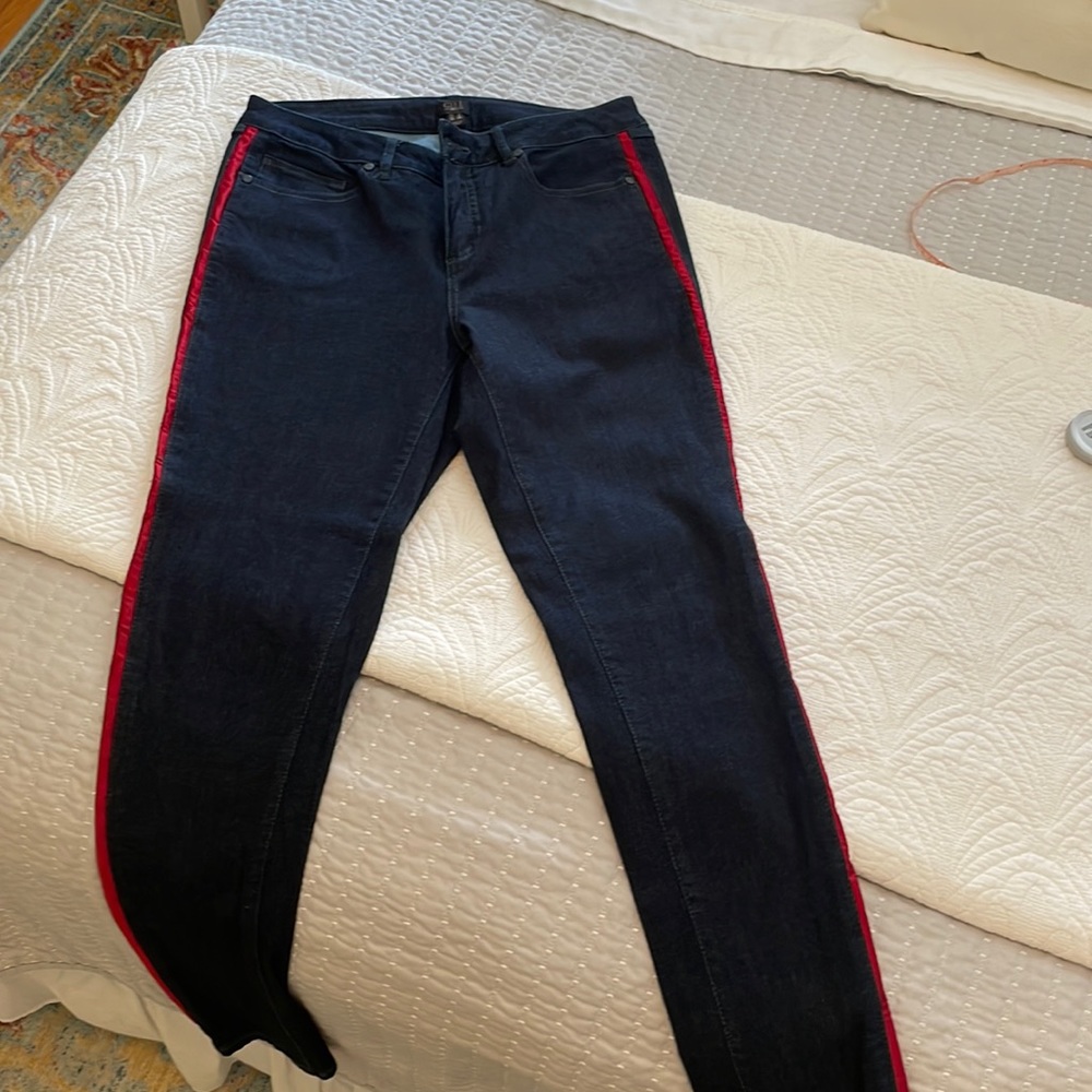 GILI very dark rinse skinny ankle jean with red satiny stripe. Size 10.
